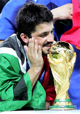 GENARO GATTUSO one of the Italian World Champions in Germany 2006 smile front of his cup won after the Grosso's penalty the Italian national team players run to celebrate... they are the new World Champions and Italy is in the very top of the world, thanks to their football soccer school, Italian football soccer school to the world thanks to WBN and AIAC - the Italian football soccer association of coaches - the Italian football soccer school offers to the international players and teams the World Champions technical and tactical training to the USA soccer teams, Canada soccer players, UAE soccer league, Saudi Arabia teams, Australia teams and soccer players. We offer also customized training for soccer lovers as begineers camps, young soccer camps, girls football soccer training and professional Italian soccer Coaches for your team, our Italian soccer school offers the most prestige and winner Football Soccer coach camps and training in the world ready to coach in your country and become a Champion in your league